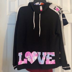Hoodie in Black with Love written on front .
